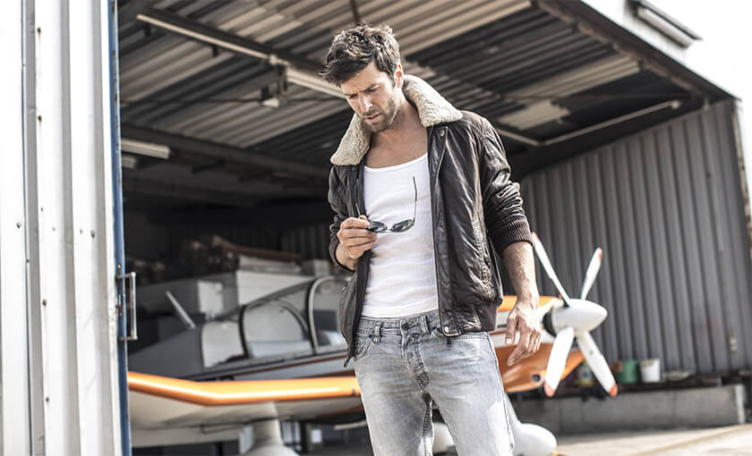 Man embodying the bad boy archetype, a classic example of an attractive personality archetype