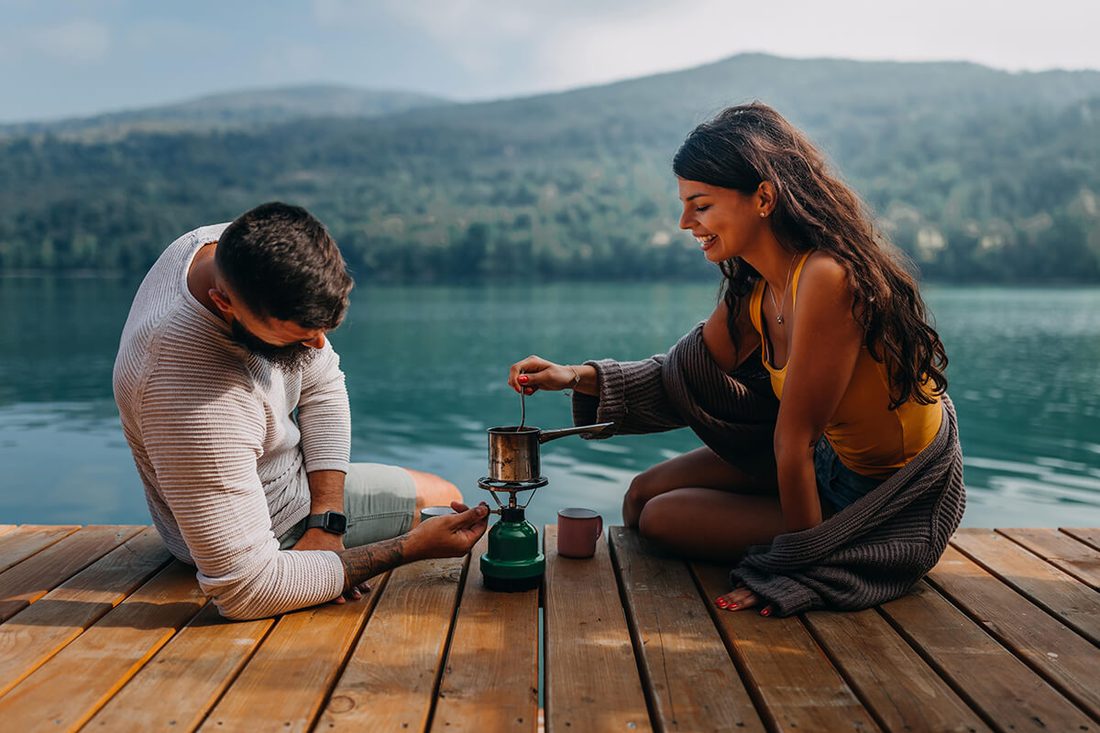 Couple enjoying a relaxed lakeside date