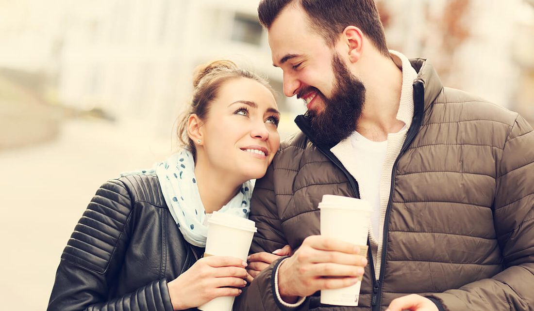 Couple meeting for coffee outdoors